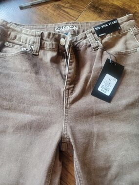 Carbon Mid Rise Flare Jeans in Brown